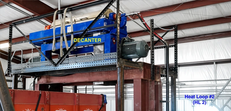 Decanter centrifuge used in a crude oil tank bottom recovery system