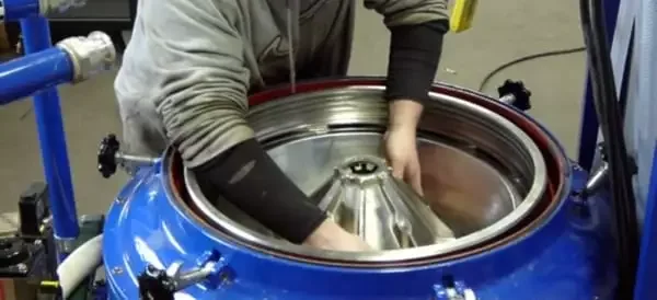 Industrial disc stack centrifuge undergoing repair and rebuild service