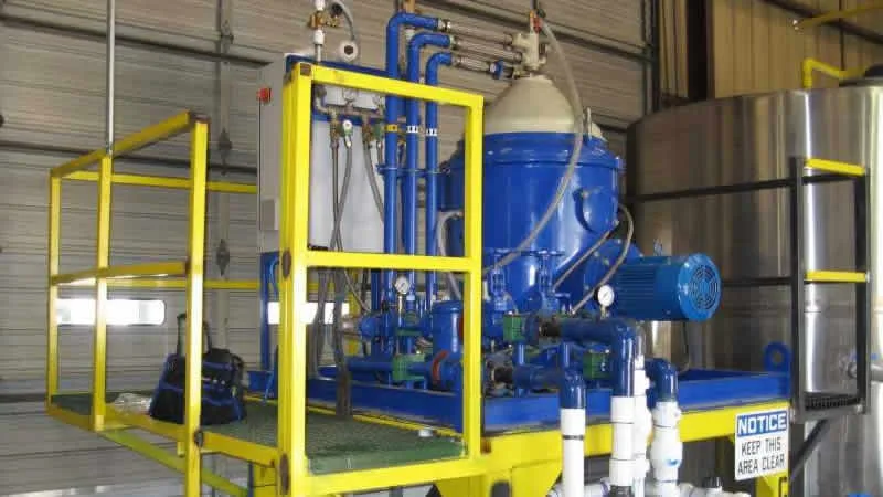 Industrial disc centrifuge processing yellow grease (WVO) at 40 GPM for large-scale UCO purification